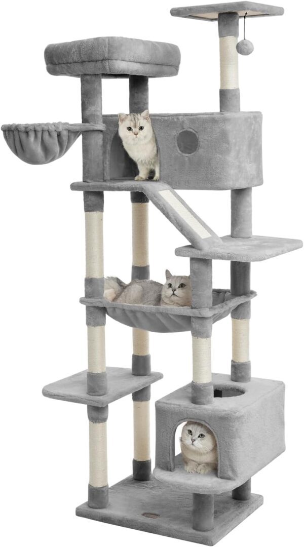 A cat sitting on top of a tower with its head up.