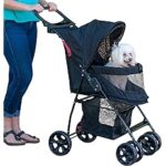 A woman is pushing her dog in the stroller.