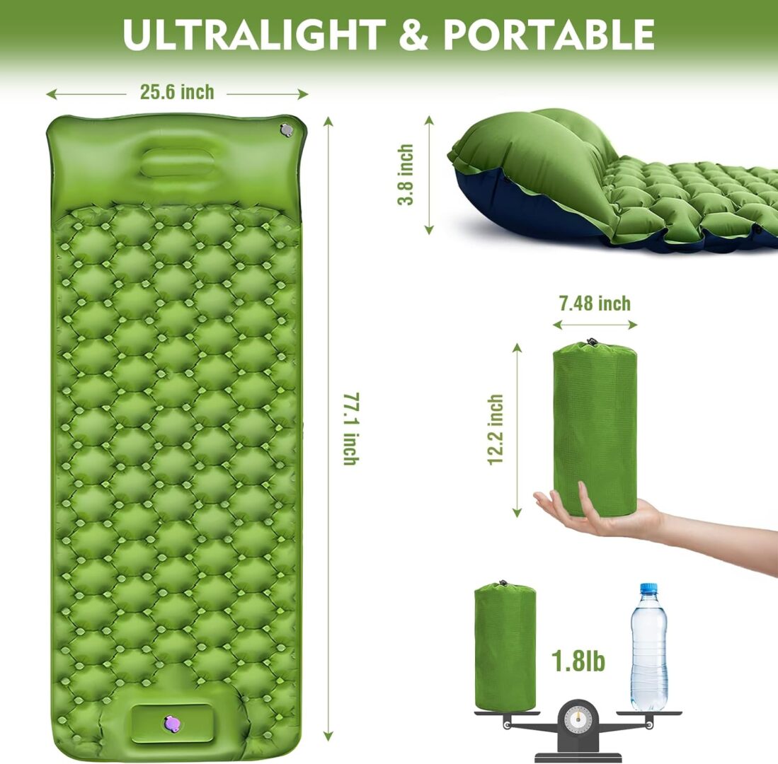 A green sleeping pad with inflated side and water bottle.