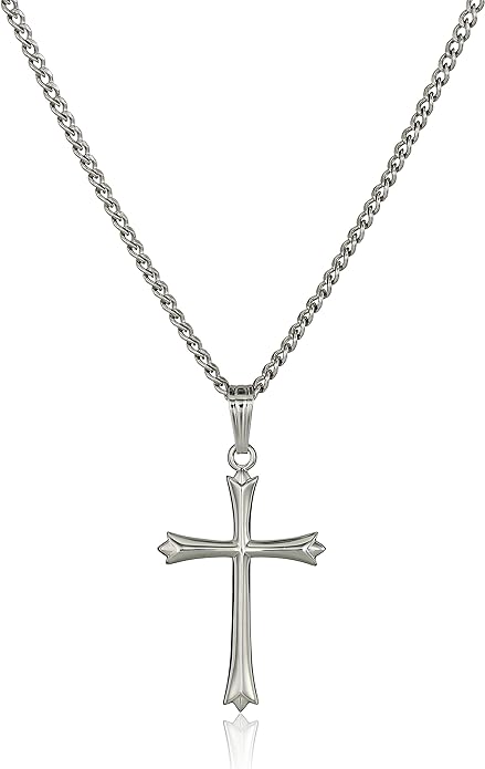 A cross necklace is shown on a chain.