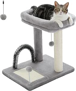 A cat sitting on top of a scratching post.