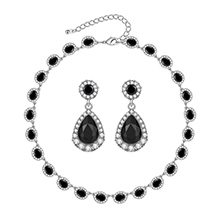 A necklace and earrings set with black stones.